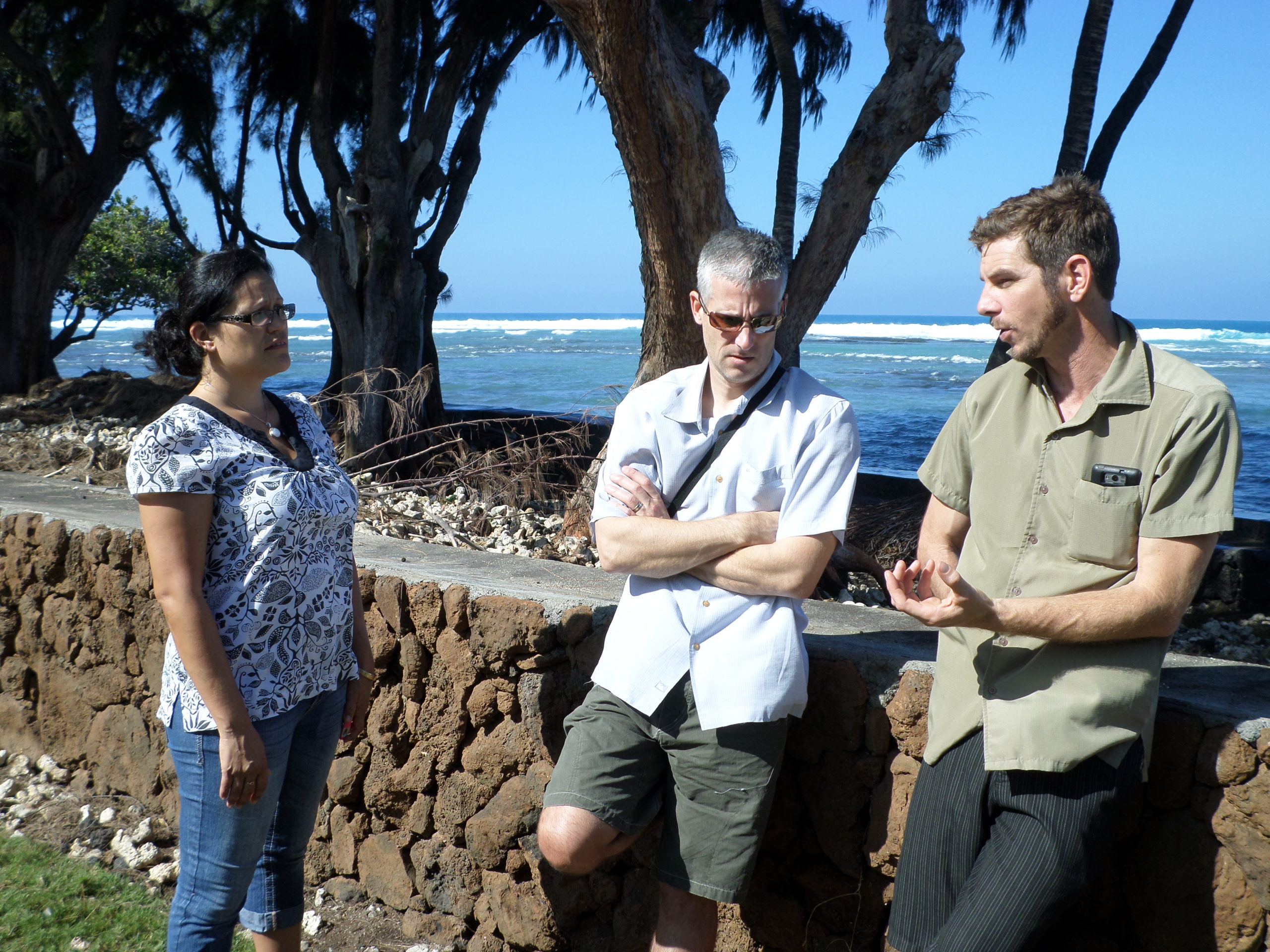 Hawai'i Field Managers Erica Perez (left) and Wes Crile (right) talk about the threats to Puako's coral reefs with Conservation Programs Director Jason Vasquez